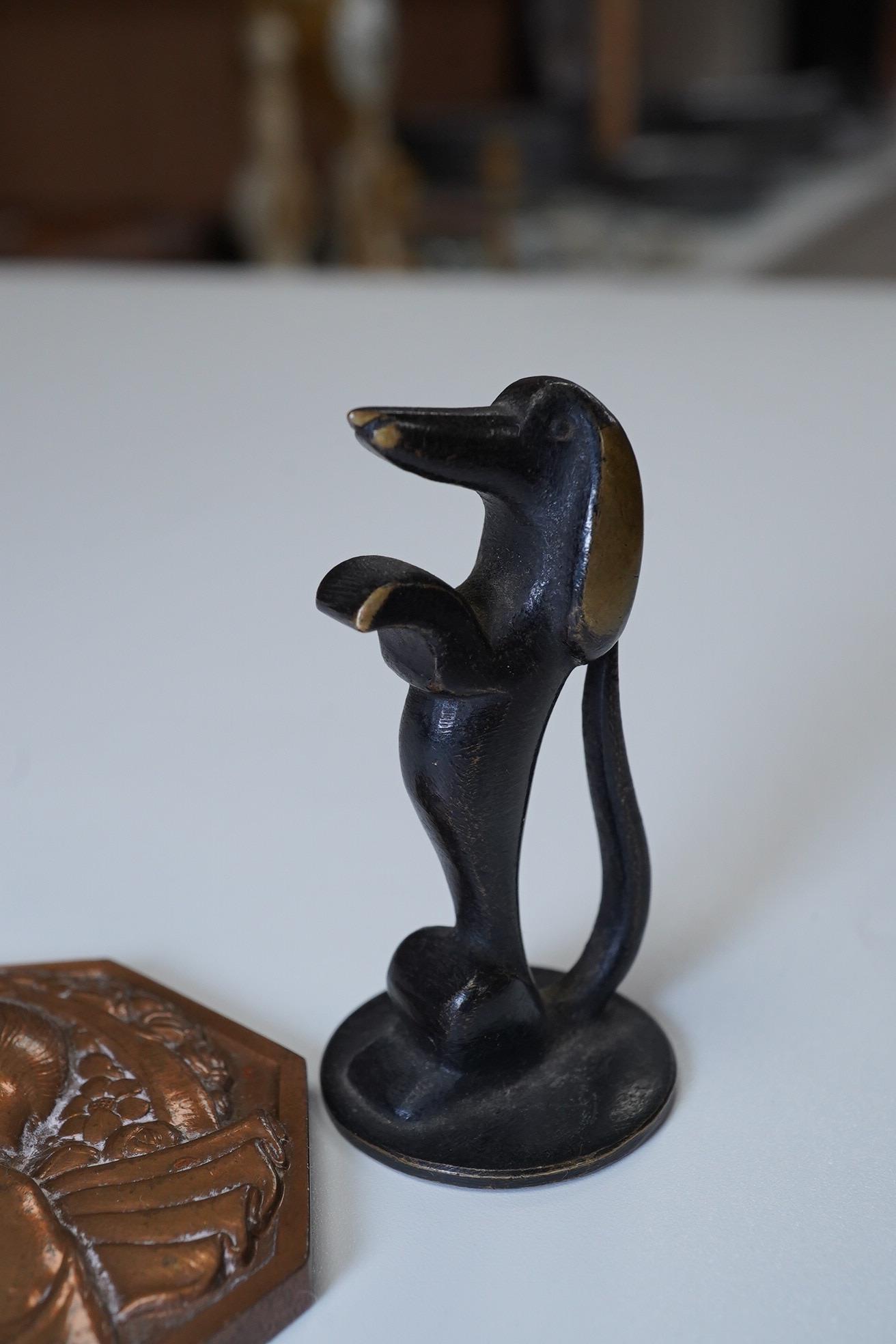 P.Turin, a small Art Deco bronze plaque and a Richard Rohac bronze dachshund. Dachshund 5cm high. Condition - good